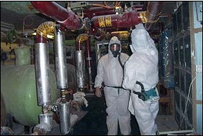 Checking for Asbestos (photo courtesy of GTC-AMAS)